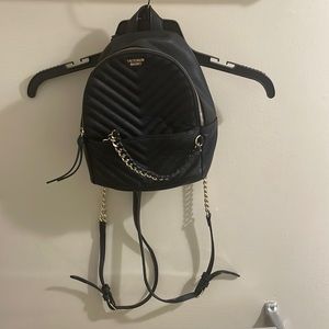 Black Victorias Secret mini backpack with gold chain detail